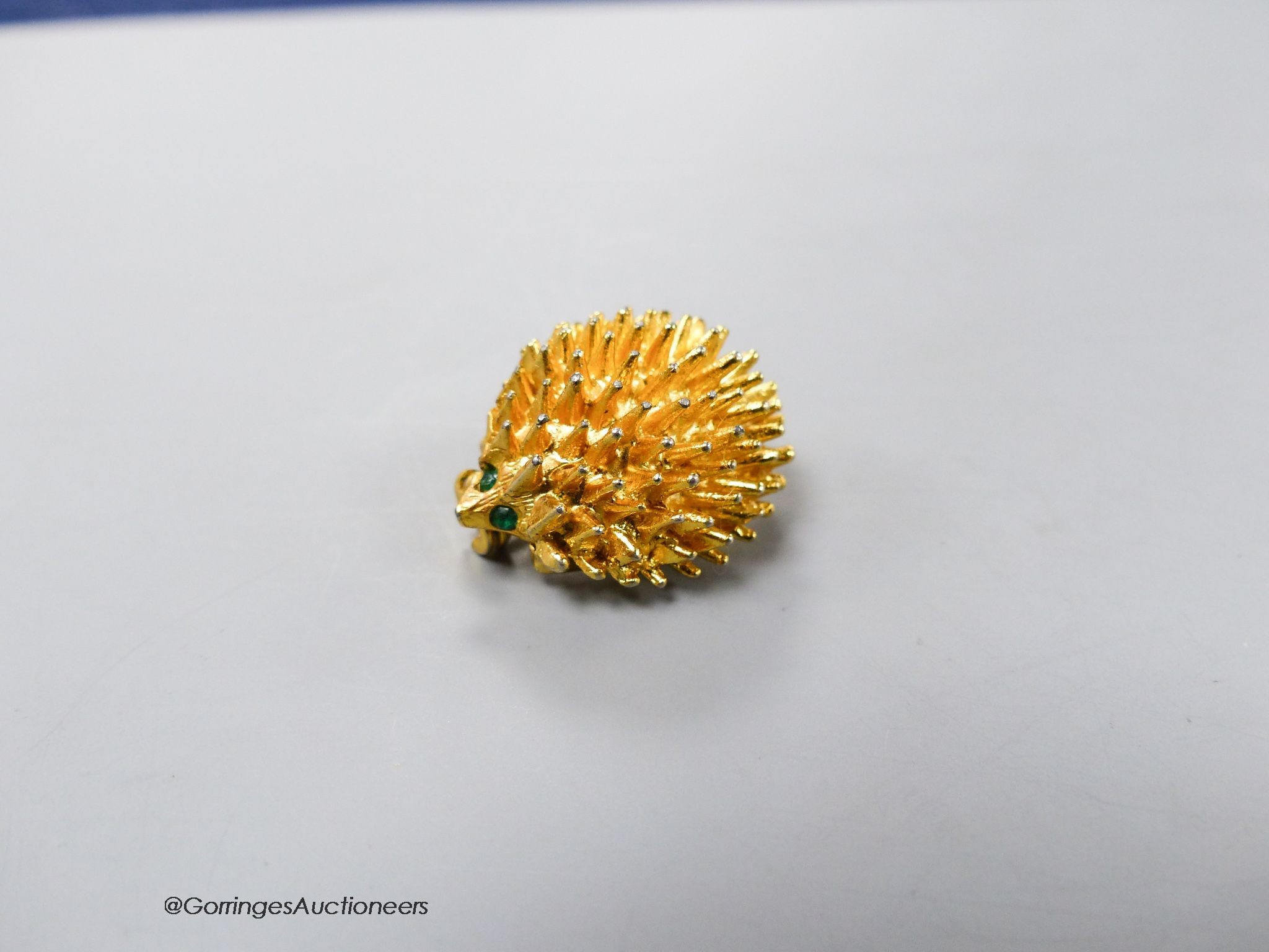 A gilt metal and paste set hedgehog brooch, 24mm.